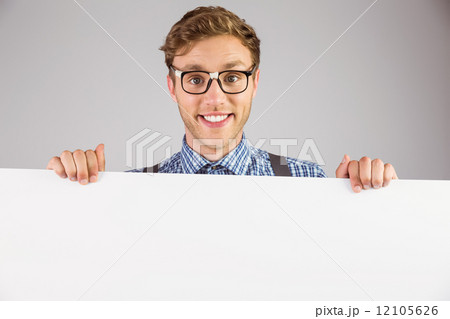 Geeky hipster showing a card 12105626