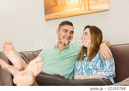 Cute couple relaxing on couch Cute couple relaxing on couch 12105788