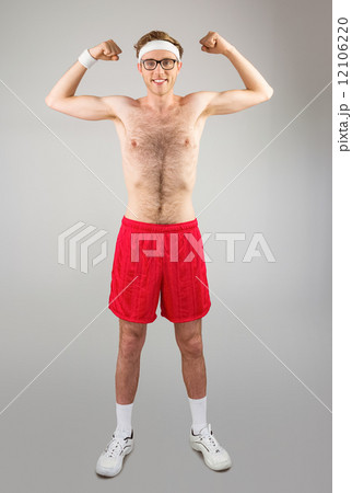 Geeky shirtless hipster flexing biceps Geeky shirtless hipster flexing biceps 12106220