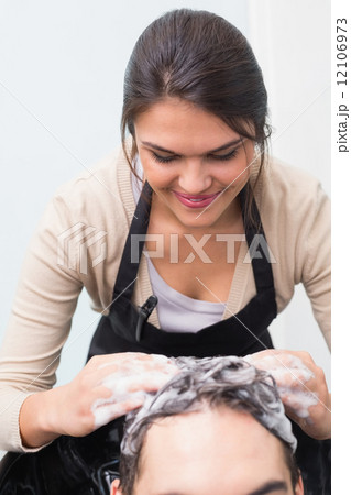 Hair stylist washing mans hair Hair stylist washing mans hair 12106973
