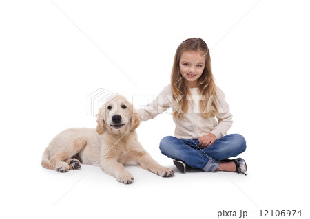 Girl holding her puppy close Girl holding her puppy close 12106974