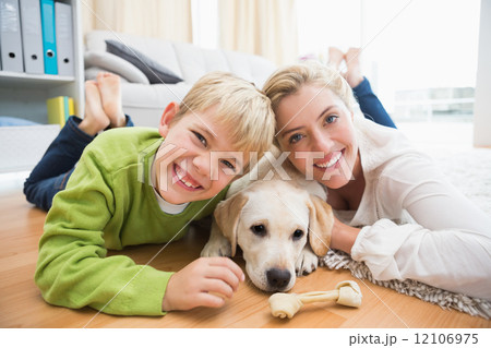 Happy mother and son with puppy 12106975