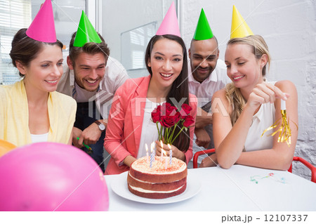 Casual business team celebrating a birthday 12107337