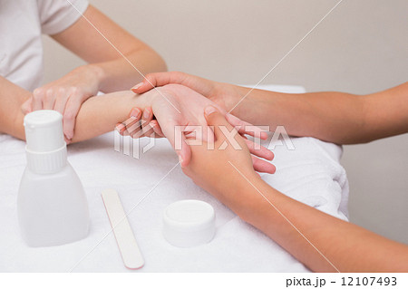 Woman getting a hand massage Woman getting a hand massage 12107493