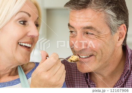 Happy mature blonde feeding pie to husband 12107906