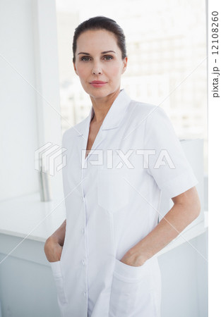 Smiling doctor looking at camera Smiling doctor looking at camera 12108260