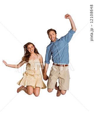 Cheerful young couple jumping 12108648