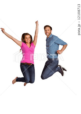 Cheerful young couple jumping 12108713
