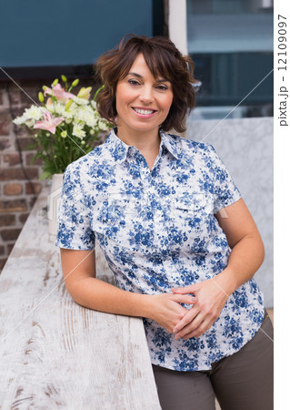 Confident hairdresser smiling at camera 12109097