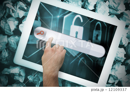 Hands touching search bar on tablet screen 12109337