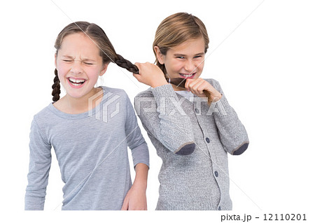Angry young boy pulling sister hair in a fight 12110201