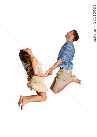 Cheerful young couple jumping Cheerful young couple jumping 12110481