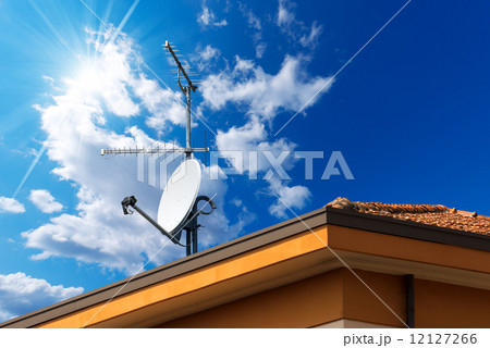 Satellite Dish and Antenna TV on Blue Sky 12127266