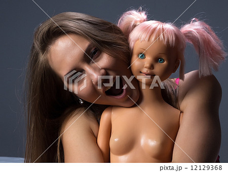 Photo of crying girl with the doll Photo of crying girl with the doll 12129368