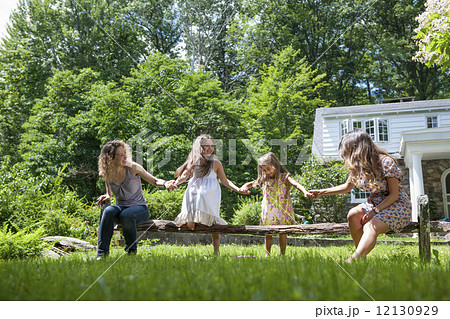 Family playing in the garden in summer. 12130929