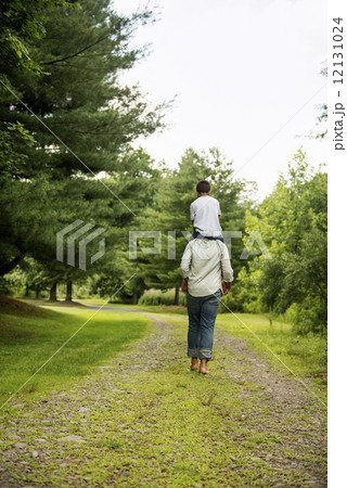 Two brothers walking on a country path. 12131024
