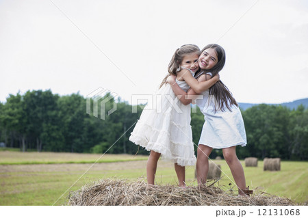 Two girls playing outdoors. Two girls playing outdoors. 12131068