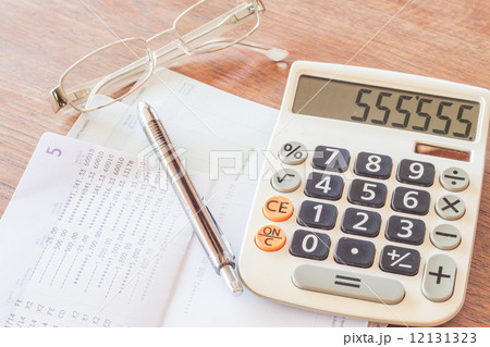 Calculator, pen and eyeglasses with bank account passbook 12131323