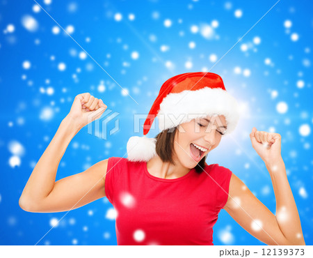 smiling woman in santa helper hat smiling woman in santa helper hat 12139373