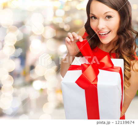 smiling woman in red dress with gift box smiling woman in red dress with gift box 12139674