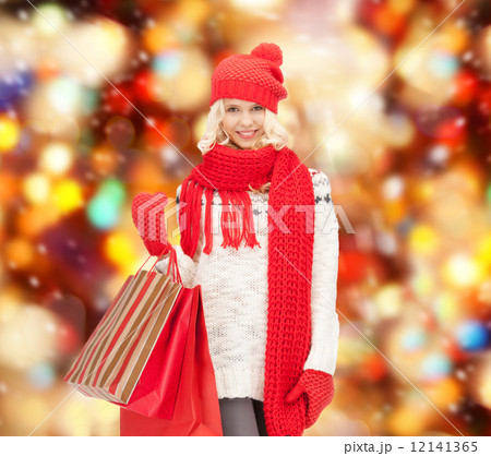 teenage girl in winter clothes with shopping bags teenage girl in winter clothes with shopping bags 12141365