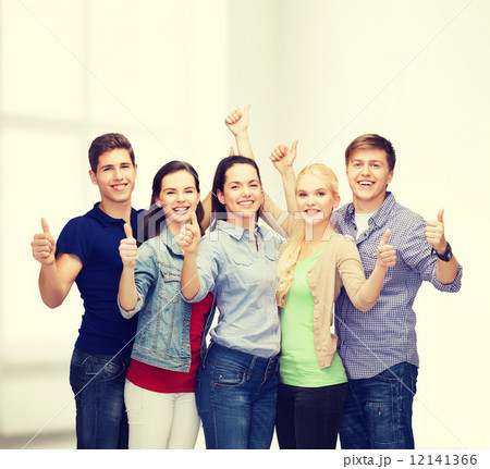 group of smiling students showing thumbs up 12141366