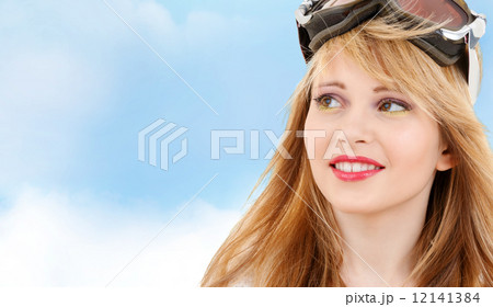 smiling teenage girl in snowboard goggles 12141384