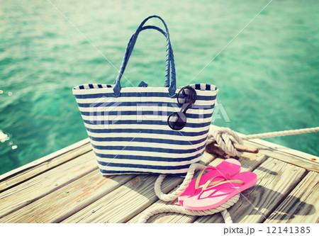 close up of beach accessories on wooden pier 12141385