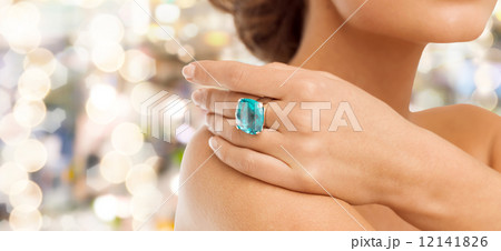 closeup of woman hand with big blue cocktail ring closeup of woman hand with big blue cocktail ring 12141826