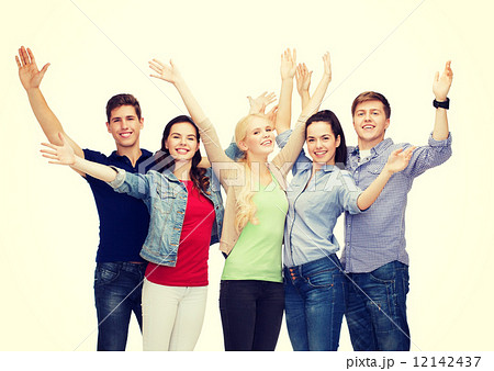 group of smiling students waving hands group of smiling students waving hands 12142437