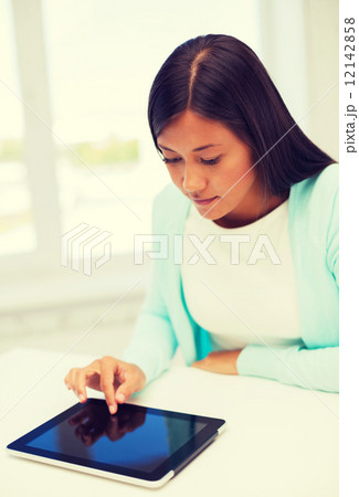 smiling student girl with tablet pc 12142858