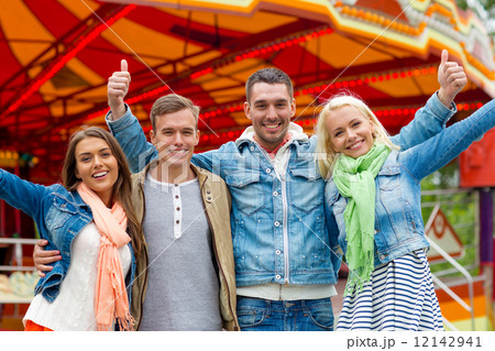 group of smiling friends showing thumbs up 12142941