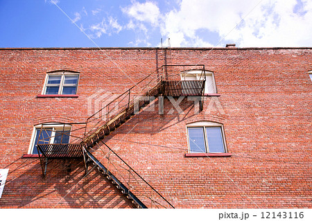 fire escape ladder and brickwall 12143116