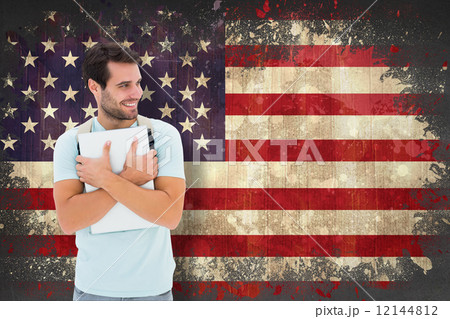 Composite image of student holding laptop Composite image of student holding laptop 12144812