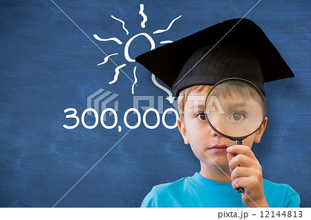 Composite image of cute pupil looking through magnifying glass 12144813