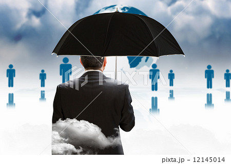 Composite image of mature businessman holding an umbrella 12145014