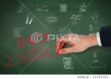 Composite image of hand writing with a chalk Composite image of hand writing with a chalk 12145161