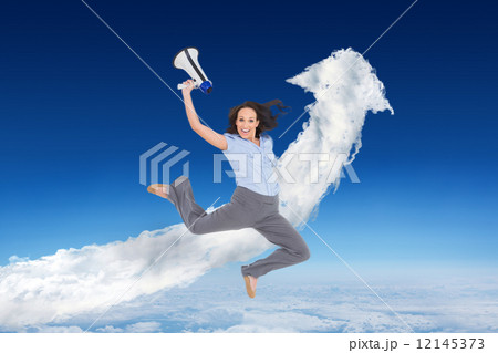 Composite image of cheerful classy businesswoman jumping while h 12145373