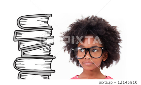 Composite image of cute pupil wearing glasses 12145810