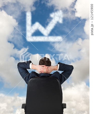 Composite image of businessman sitting in swivel chair Composite image of businessman sitting in swivel chair 12145900