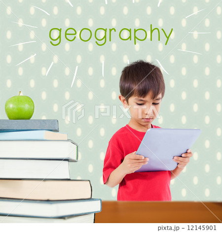 Geography against red apple on pile of books Geography against red apple on pile of books 12145901
