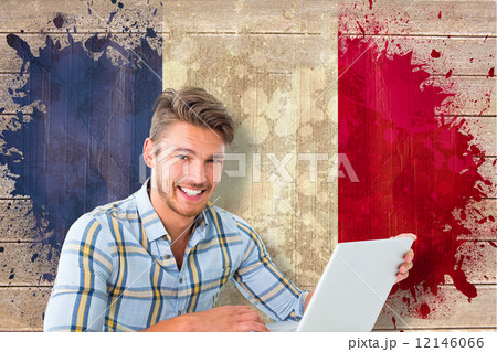 Composite image of young student using laptop 12146066