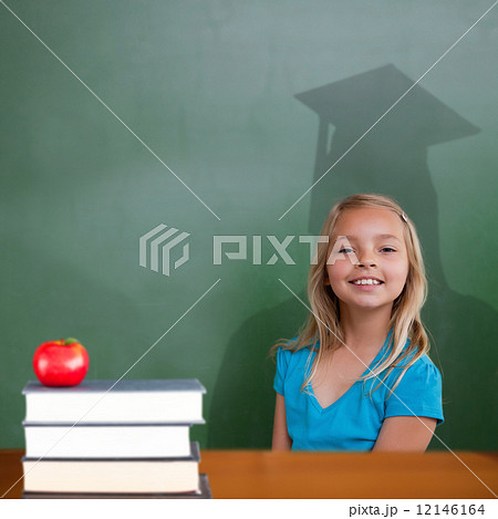Composite image of cute pupil with graduate shadow Composite image of cute pupil with graduate shadow 12146164