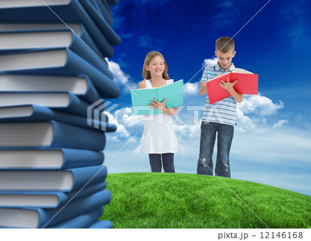 Composite image of brother and sister doing their homework toget Composite image of brother and sister doing their homework toget 12146168