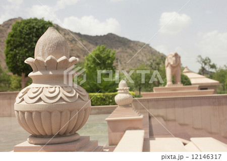 statue of pot and elephant in jain temple 12146317