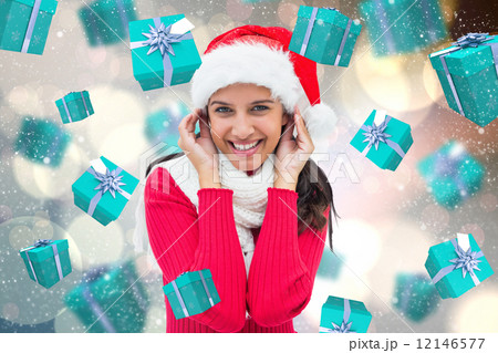 Composite image of festive brunette 12146577