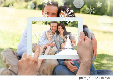 Composite image of hands holding tablet pc Composite image of hands holding tablet pc 12146750
