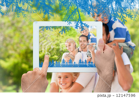 Composite image of hands holding tablet pc Composite image of hands holding tablet pc 12147596