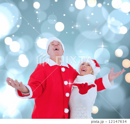 Composite image of festive mature couple 12147634