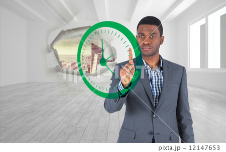 Composite image of focused businessman pointing Composite image of focused businessman pointing 12147653